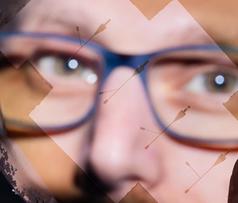 UCLA Scientist DiCarlo peers through one of the lab’s microfluidic devices. 