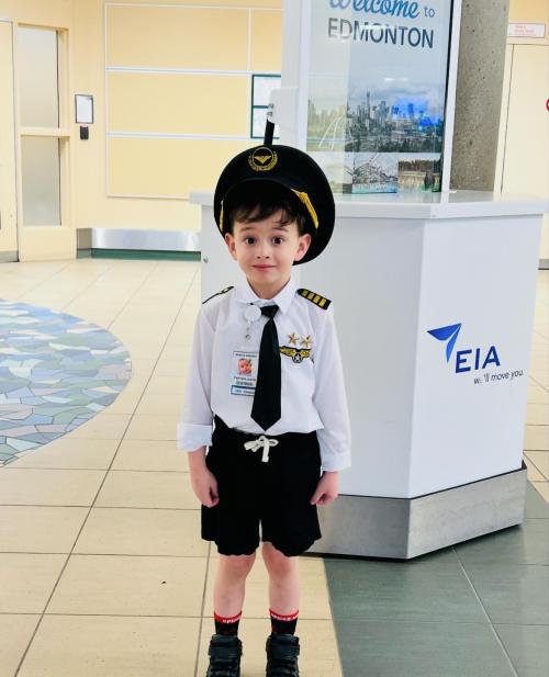 Jakob Guziak dressed as a pilot for his first trip on an airplane.