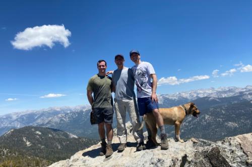 Carmichael Family Photo on a mountain top with a dog.