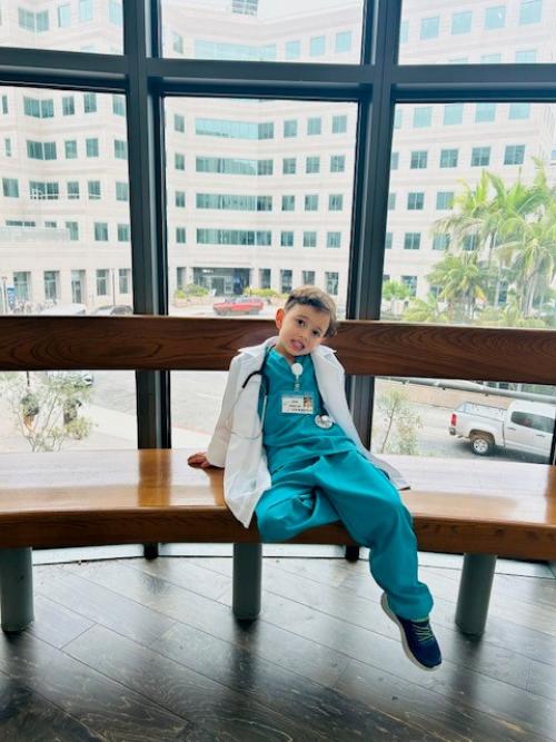 Jakob Guziak smiles in a hospital lobby.