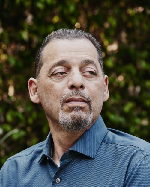 Andrew Macias photographed outside.