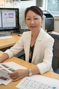 Headshot of Lili Yang at her office desk