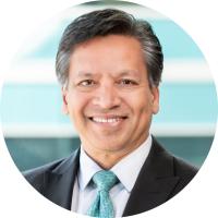 headshot of deepak srivastava wearing a suit and blue tie