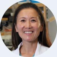 headshot of linda liau wearing a white lab coat