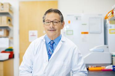 Don Kohn smiles in a UCLA lab. 