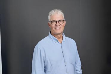 A photograph of a smiling Guy Sauvageau, M.D., Ph.D. 