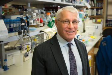 Dr. Owen Witte smiles for a photo in a UCLA lab.