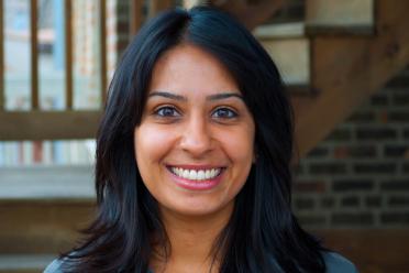 photo of smiling woman with longer than shoulder length black hair