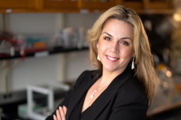 Dr. Tanya Stoyanova, a researcher at UCLA, smiles in a lab.