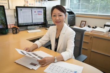 Photograph of Lili Yang, PhD at desk