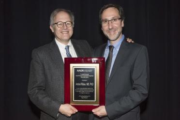 Dr. Ethan Dmitrovsky (left) congratulates Ribas on receiving the award. Dmitrovsky, provost and executive vice president at The University of Texas MD Anderson Cancer Center, was a member of the award selection committee.