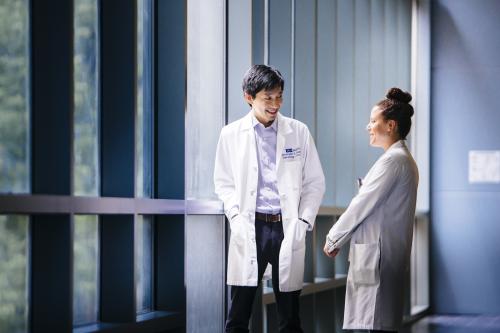 Two doctors talking in hallway