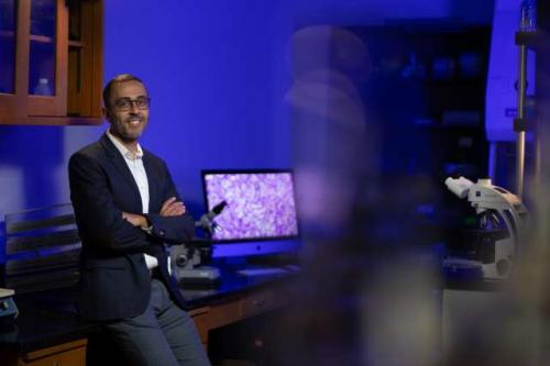 Dr. Mina Sedrak smiles in a UCLA laboratory. 