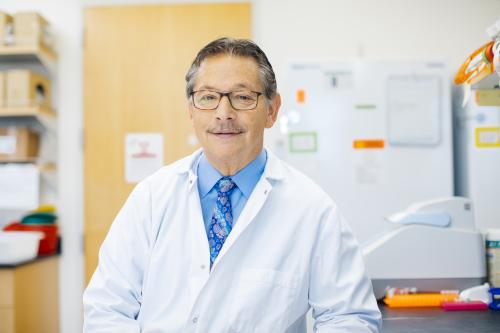 Don Kohn smiles in a UCLA lab. 