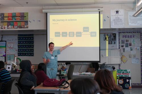 Tyler McCaw presents his science journey to high school students during a BSCRC outreach visit