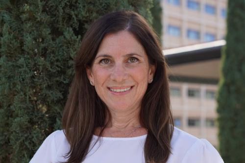 UCLA physician-scientist Aya Barzelay-Wollman smiles for a headshot outdoors.