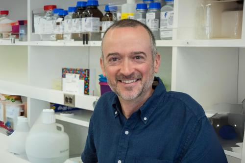 Stuart Conway smiles in a lab.