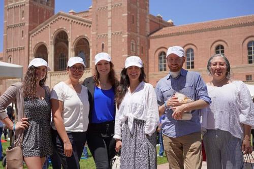 UCLA BSCRC employees smile and stand shoulder to shoulder.