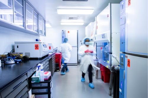 blurry lab scene featuring two researchers in PPO
