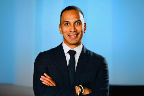 UCLA researcher Claudio Villanueva smiles for a headshot.