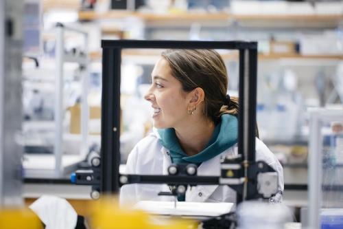 a young scientist working in a bioengineering lab