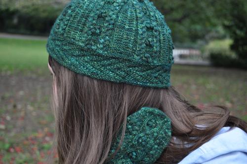 green fitted knit hat on a woman's head