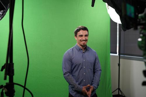 Photo of center trainee Christopher Ochoa elevator speech behind the scences