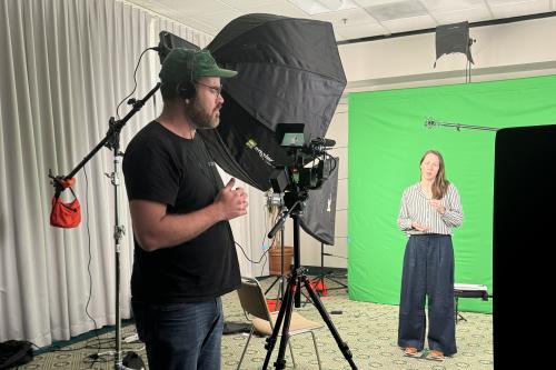trainee Jennifer Chia recording her elevator speech in front of a camera