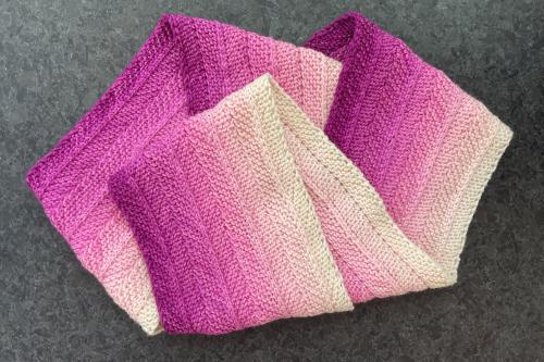 knit scarf in an ombre pink pattern