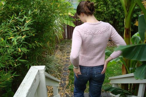 woman wearing a pink knitted sweater