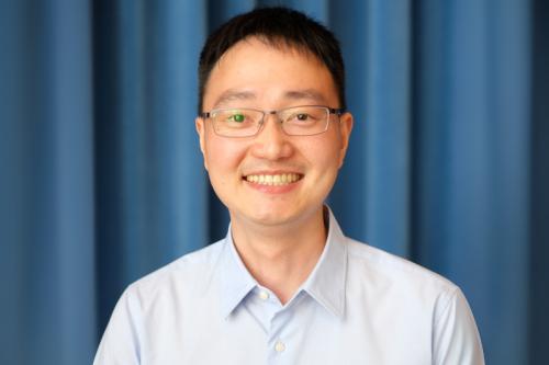 Jijun Huang smiles for a headshot.