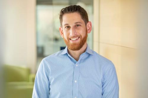 Jonathan Herman smiles for a photograph.
