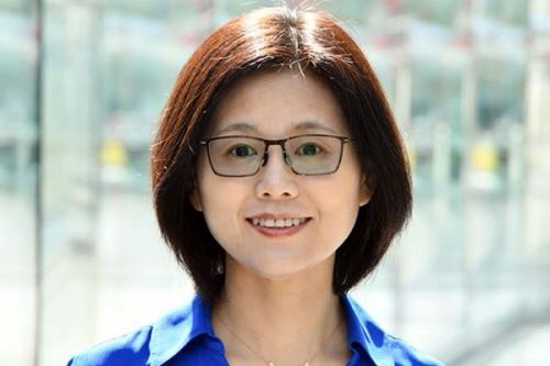 A headshot of Dr. Meng Wang, the speaker for the Metabolic Signals in Longevity Regulations Across Scales seminar. Dr. Wang is pictured smiling, and is wearing a blue blouse and glasses.