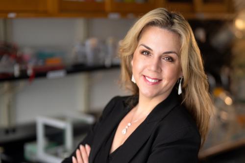 Dr. Tanya Stoyanova, a researcher at UCLA, smiles in a lab.
