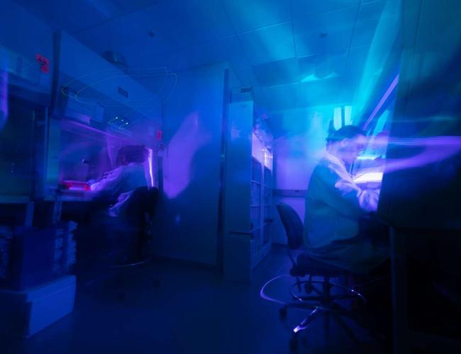 Artistically shot image of a UCLA lab facility with deep blue tones.