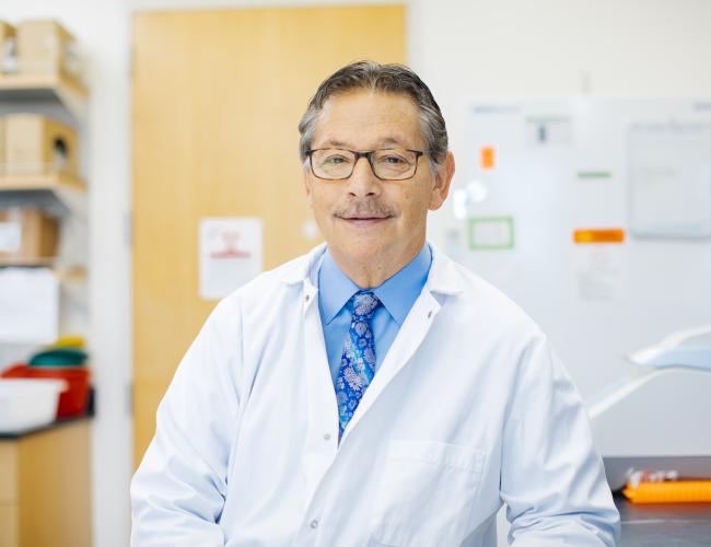 Don Kohn smiles in a UCLA lab. 