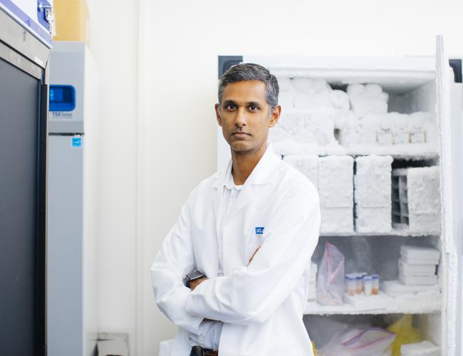 Dr. Ranmal Samarasinghe in his UCLA lab wearing a white coat.
