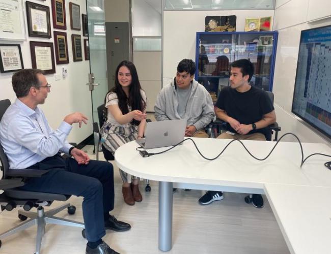 Dr. Antoni Ribas going over B2M/MHC class I data with Mildred Galvez and lab members Egmidio Medina and Justin Saco.