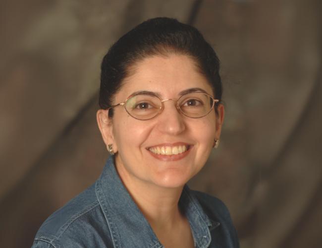 Marlin Touma, M.D., Ph.D. smiles for a headshot