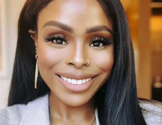 Chandra Wallace smiles for a photograph. 