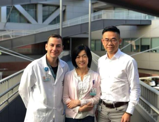 Hsian-Rong Tseng, Yazhen Zhu and Vatche Agopian stand smiling outside a building under the sunlight.