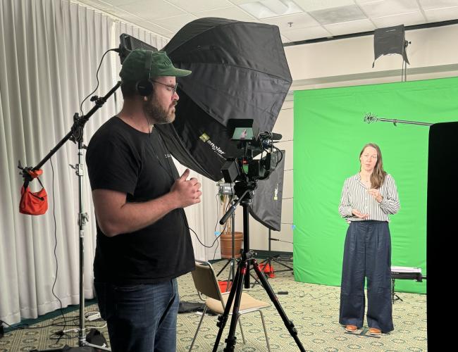 trainee Jennifer Chia recording her elevator speech in front of a camera
