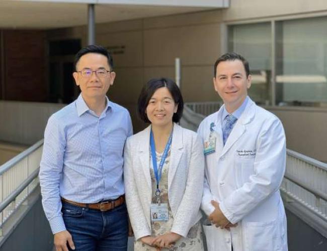 Hsian-Rong Tseng, Yazhen Zhu and Vatche Agopian stand smiling outside a building.