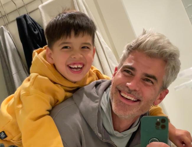 Jeffrey Randall Allen smiles with his son Lucas, who has creatine transporter deficiency, in a candid moment highlighting their bond and advocacy for rare disease gene therapy