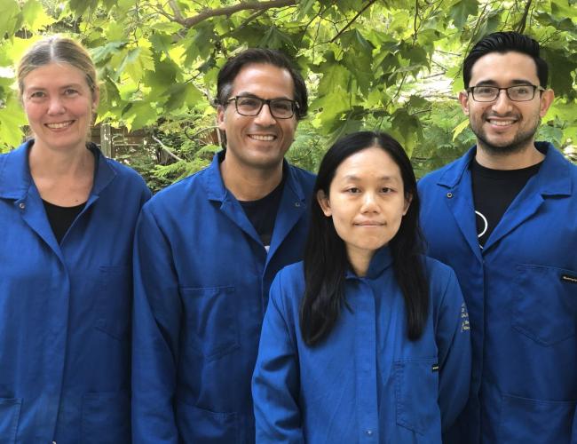 Maria Vogelauer, Siavash Kurdistani, Chen Cheng and Oscar Campos smile for a photo outside.
