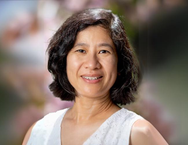 Xin Sun smiles for a headshot