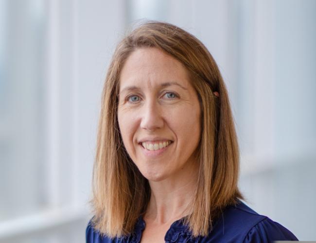 A photograph of a smiling Penney Gilbert. 