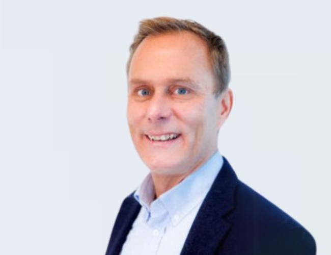 Cédric Blanpain, M.D., Ph.D. smiles for a headshot.