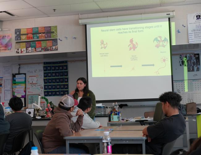 Trainee Jessenya Mil presenting her research to high school students