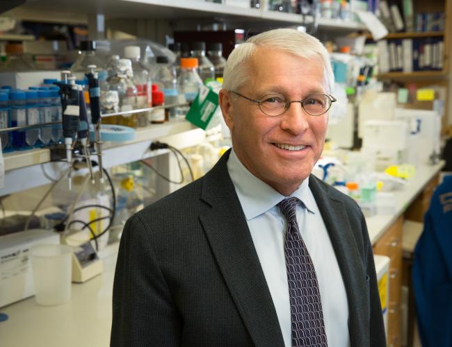 Dr. Owen Witte smiles for a photo in a UCLA lab.